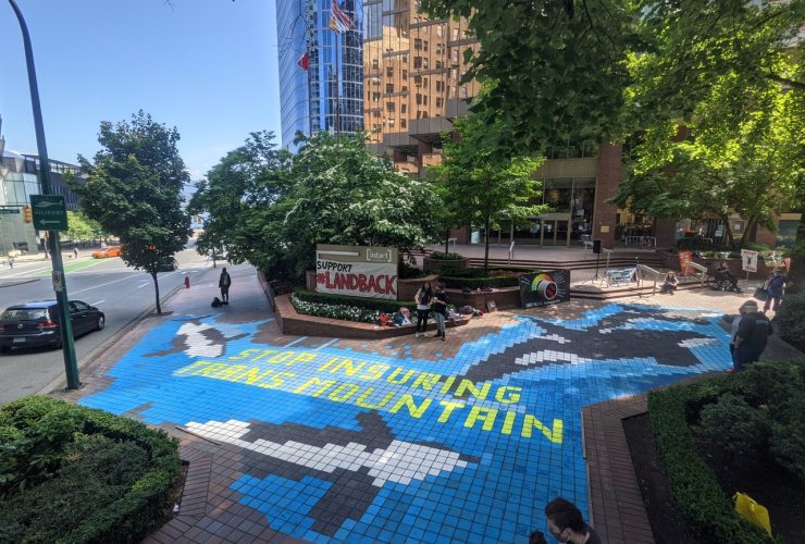 Mural that says "Stop Insuring Trans Mountain"