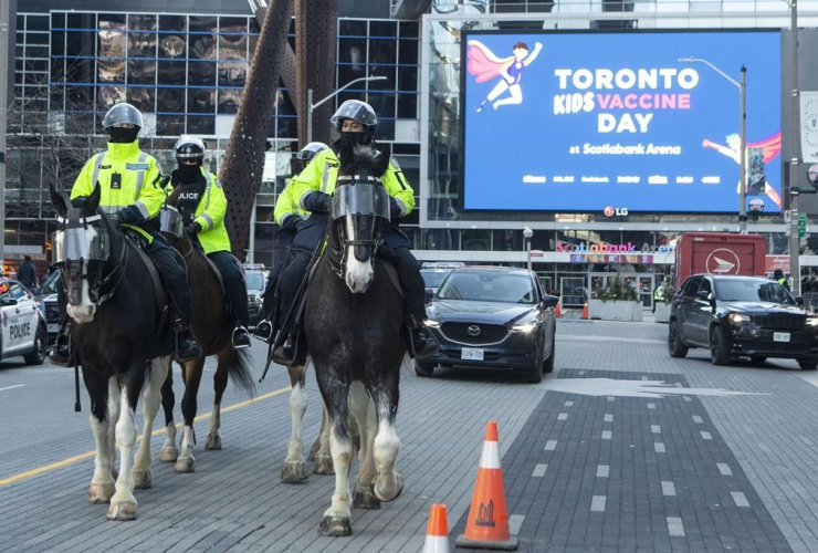 Police patrol, COVID-19 vaccine clinic, Scotiabank Arena, Toronto, 